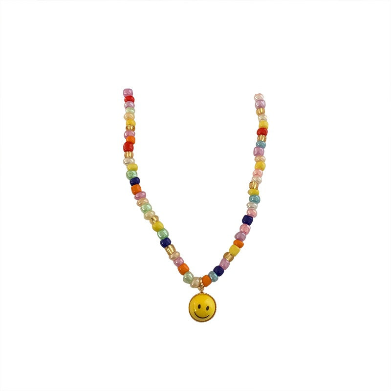 Venta al por mayor Collar de cara de sonrisa de perlas de color de vidrio